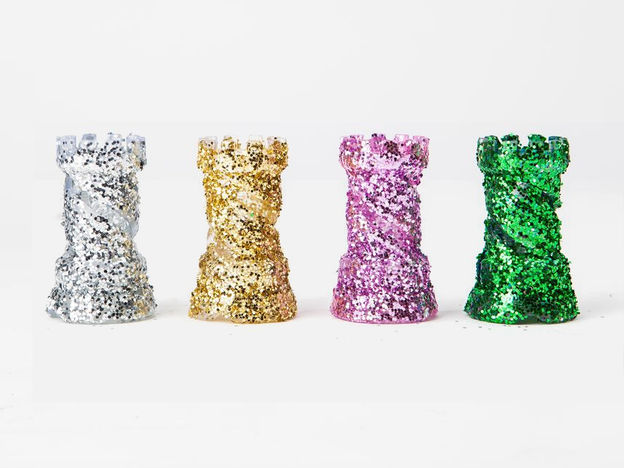 Four rooks 3D-printed with glitter resin.