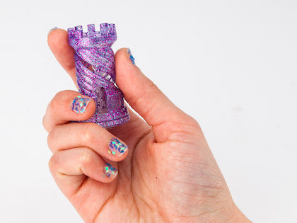 Katherine holds a rook in her hand.