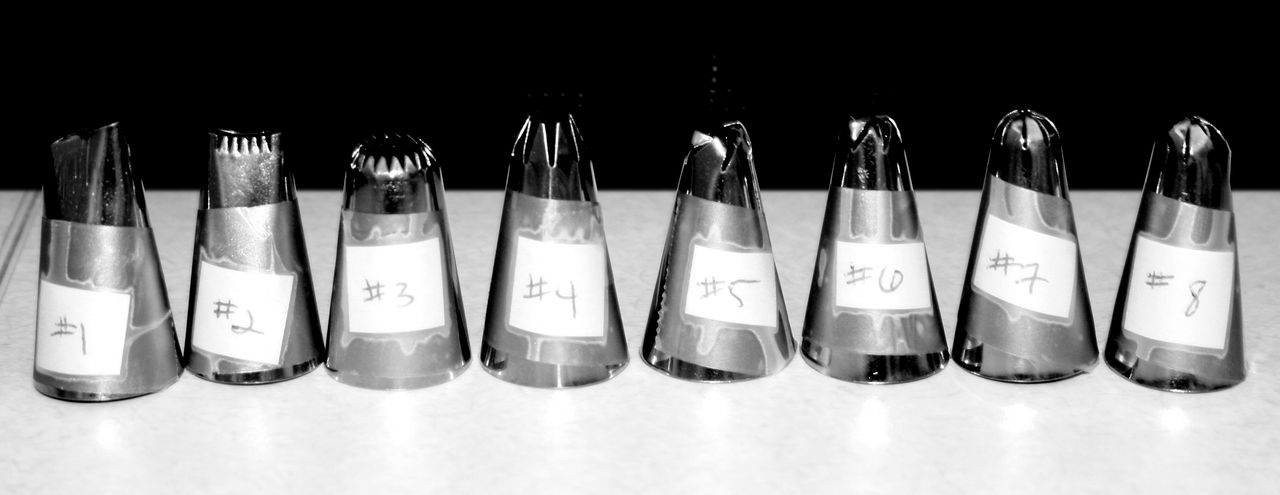 A set of frosting tips numbered 1 through 8.